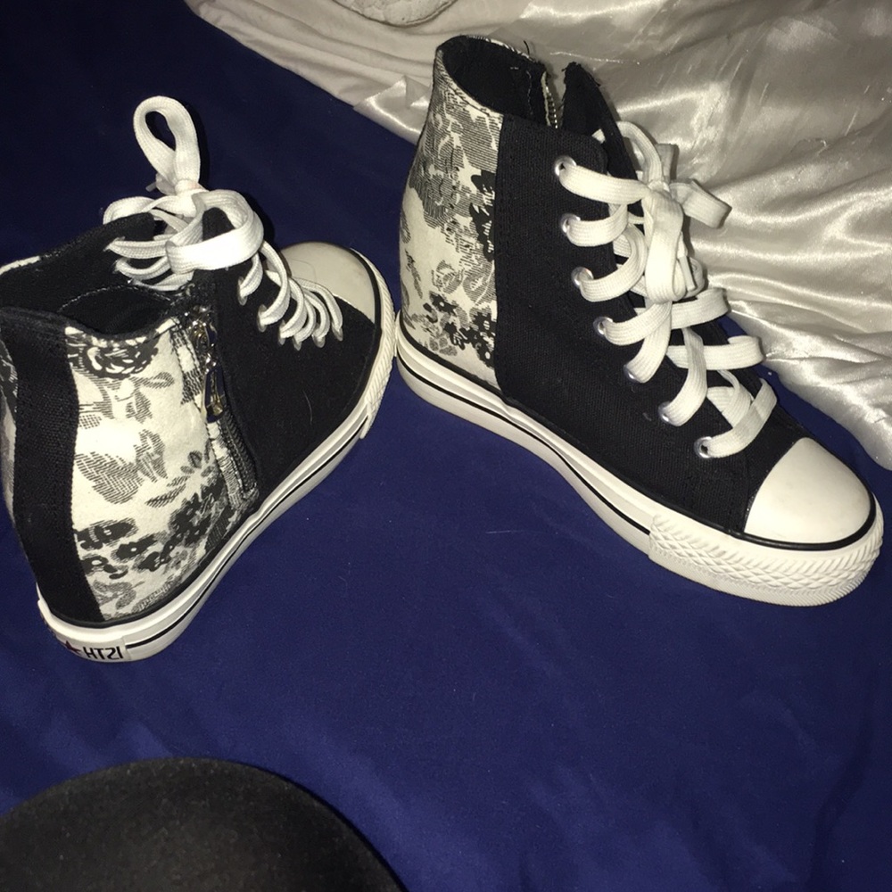 Black and white healed high tops.